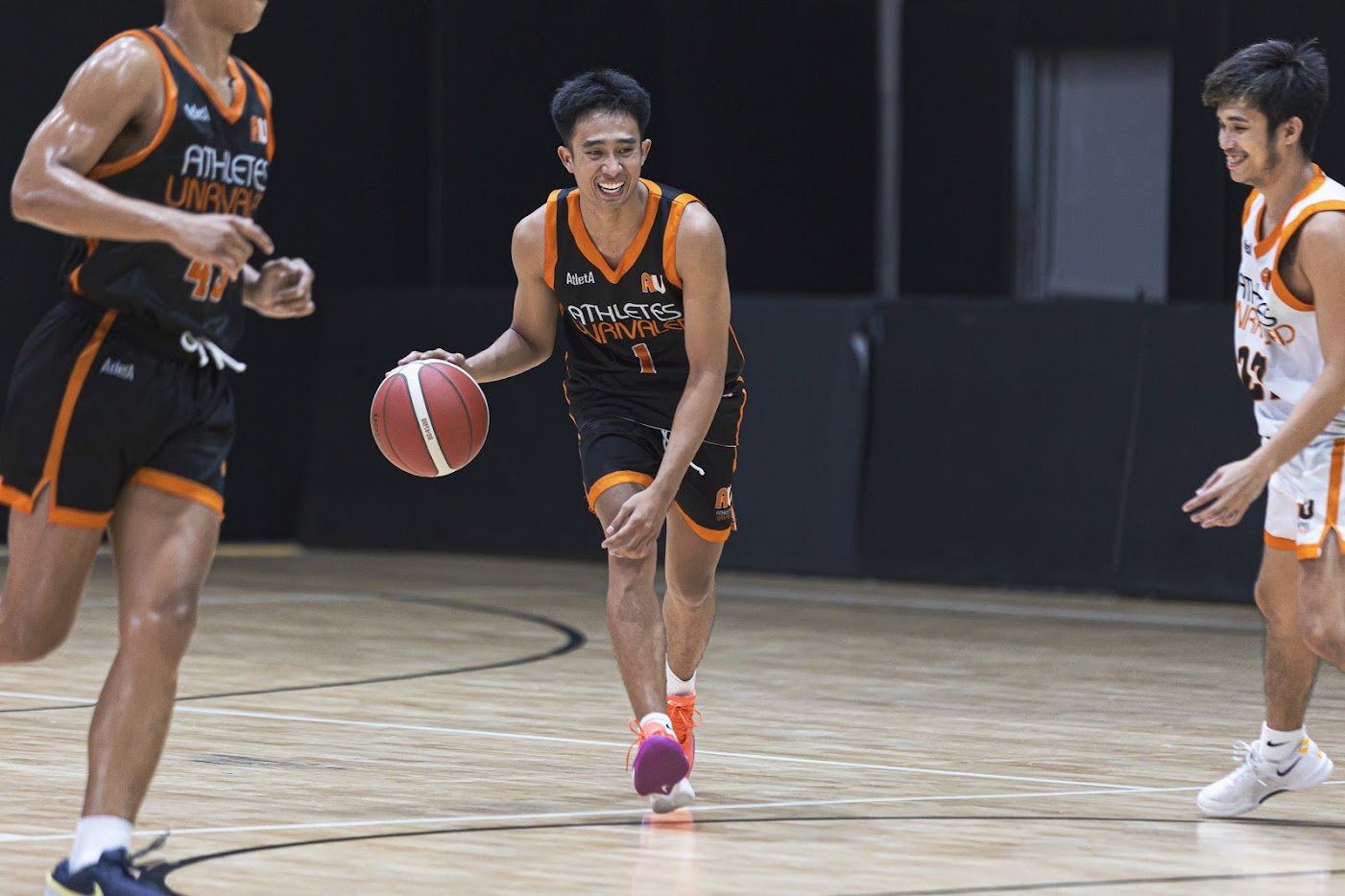 Athletes Unrivaled player advancing the ball in live play
